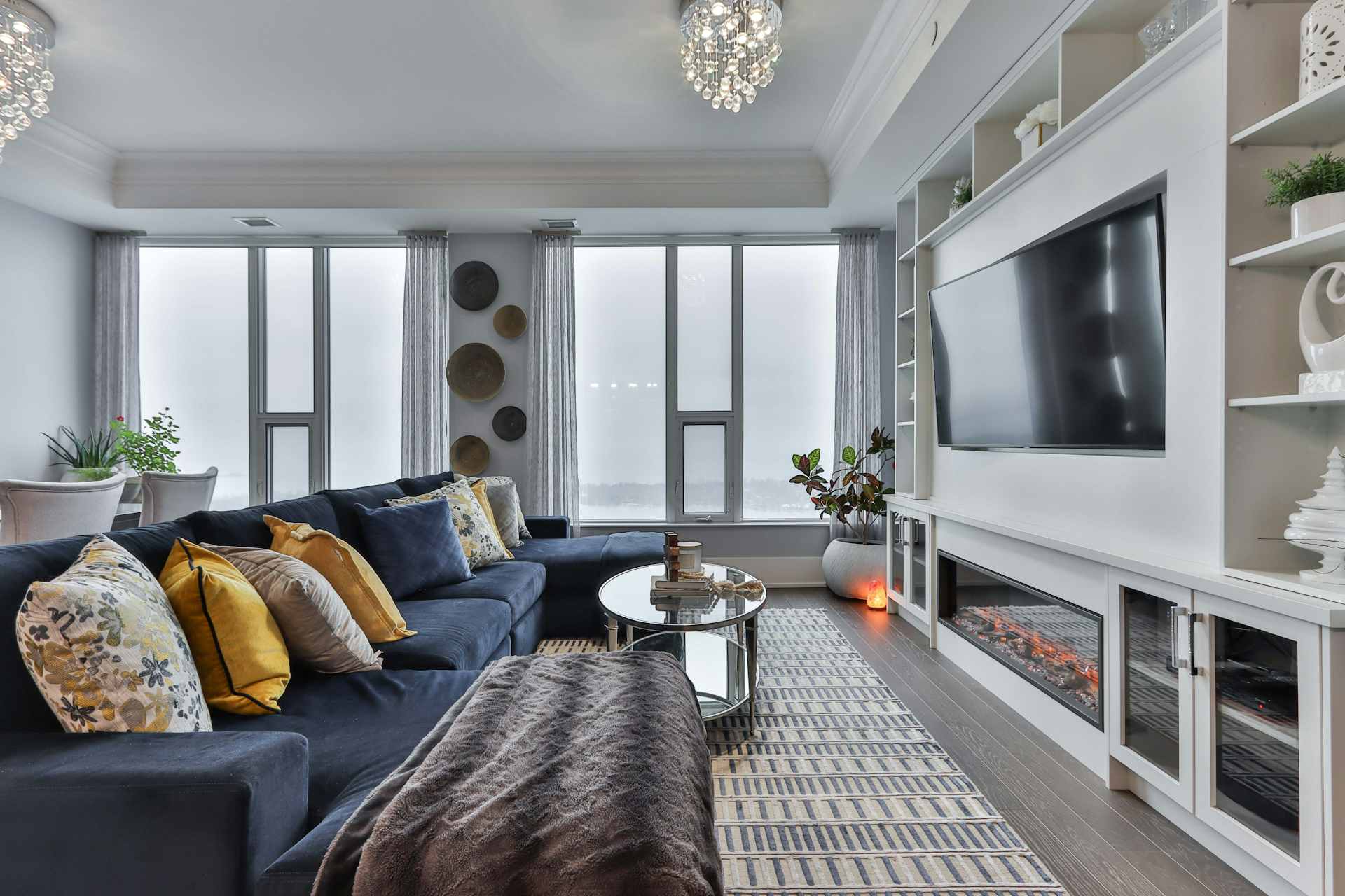 Premium living room with integrated media wall and electric fire