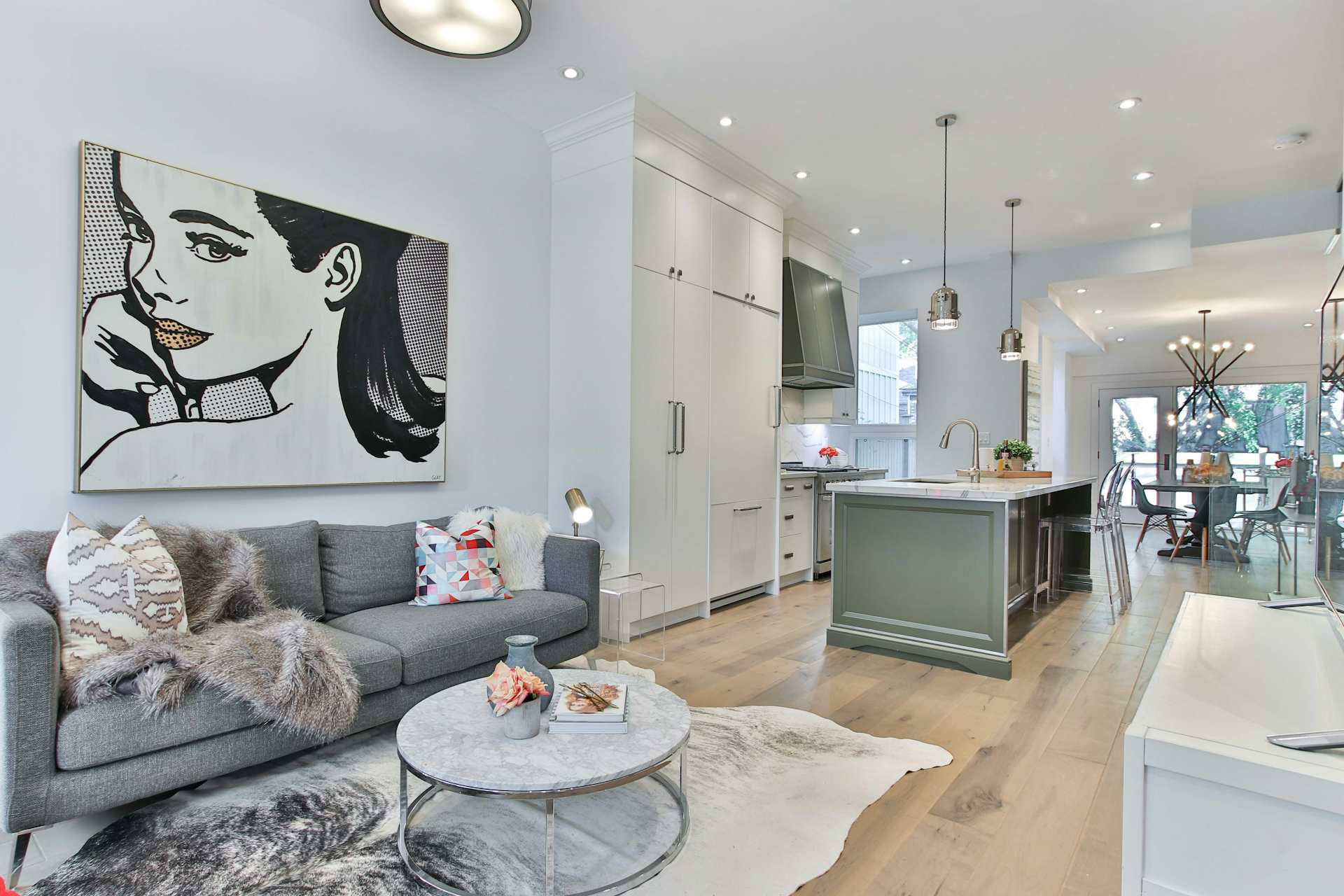Freshly decorated open-plan living space with modern lighting
